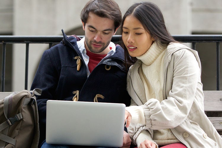 couple looking at a laptop computer screen
