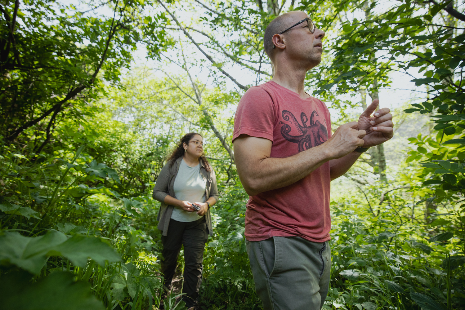 Image of Kabir Peay and Lauren Ward search for a location to gather soil samples in Point Reyes.