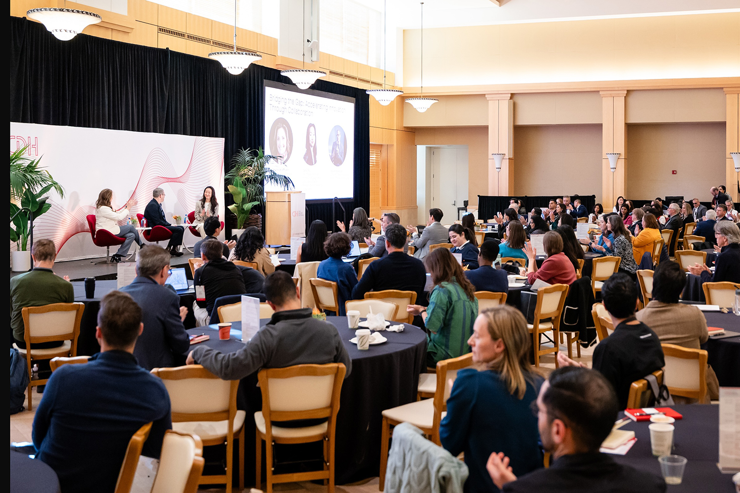 Wide shot of Digital Health symposium audience and stage