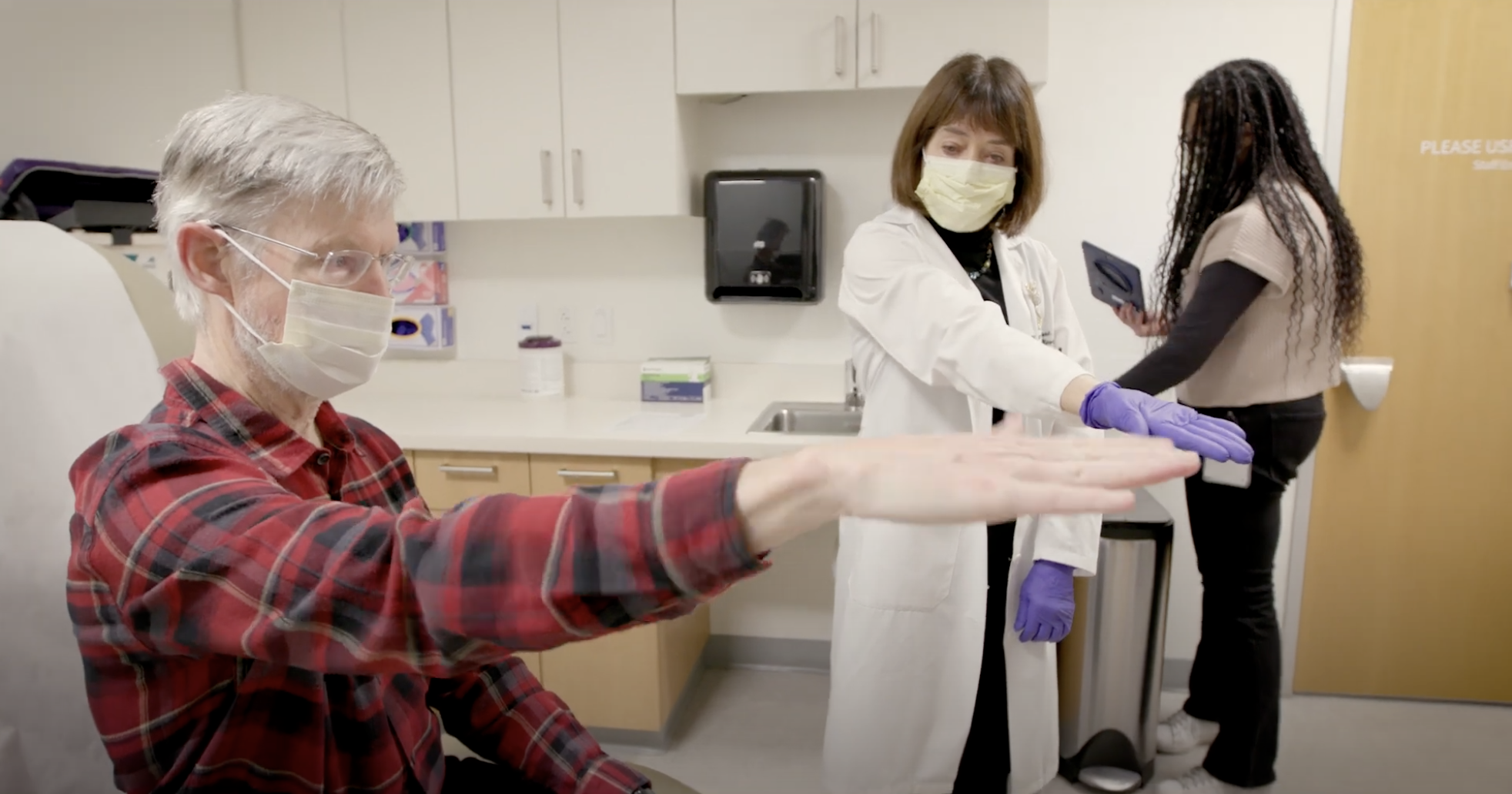 Neurologist Helen Bronte-Stewart works with patient Keith Krehbiel.