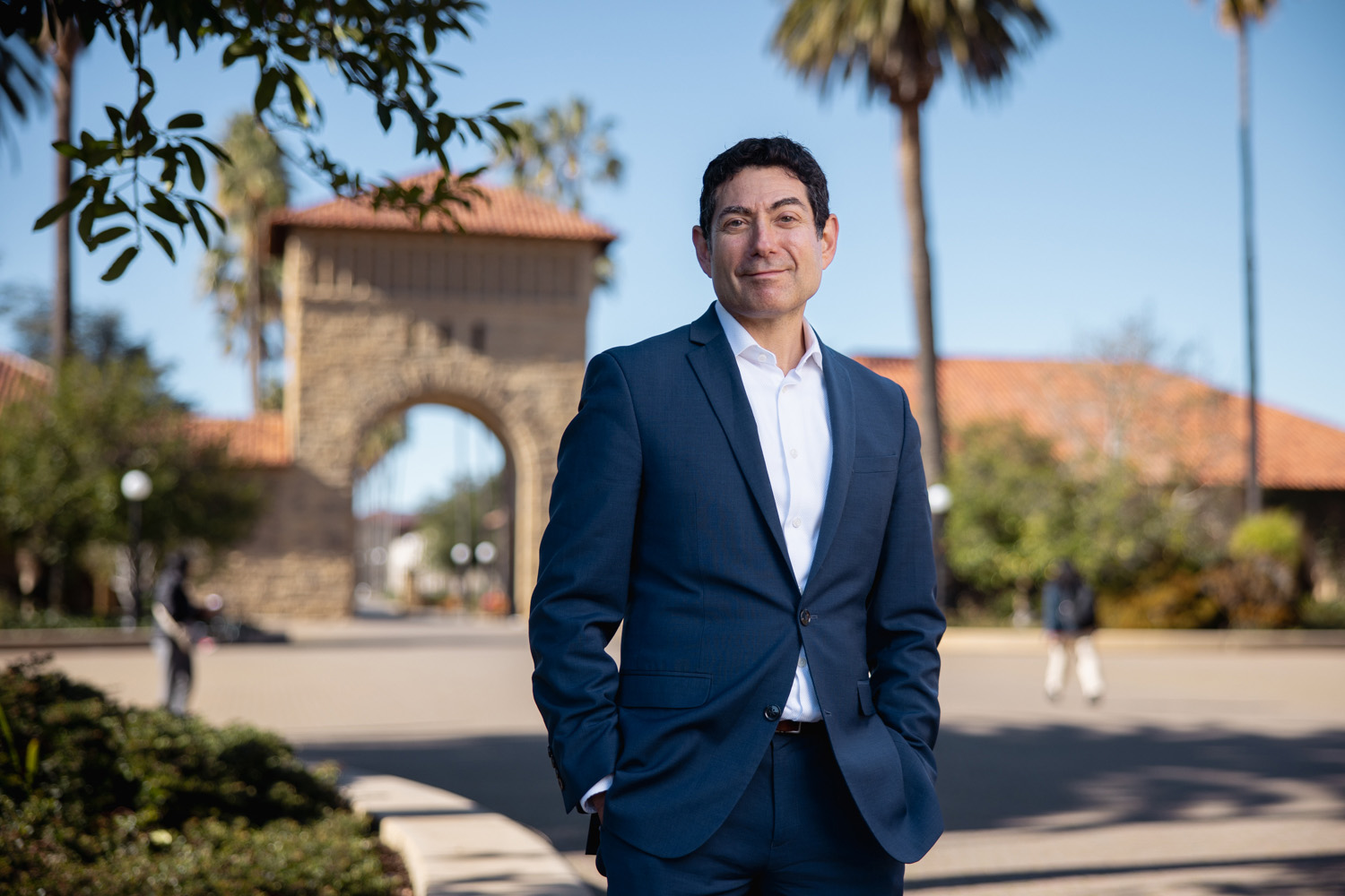 Mariano-Florentino Cuéllar stands in the Main Quad.