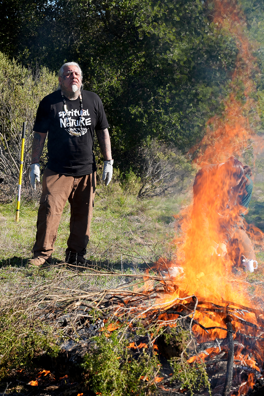 Joey Iyolopixtli Torres leading the prayer during the pre-burn ceremony.