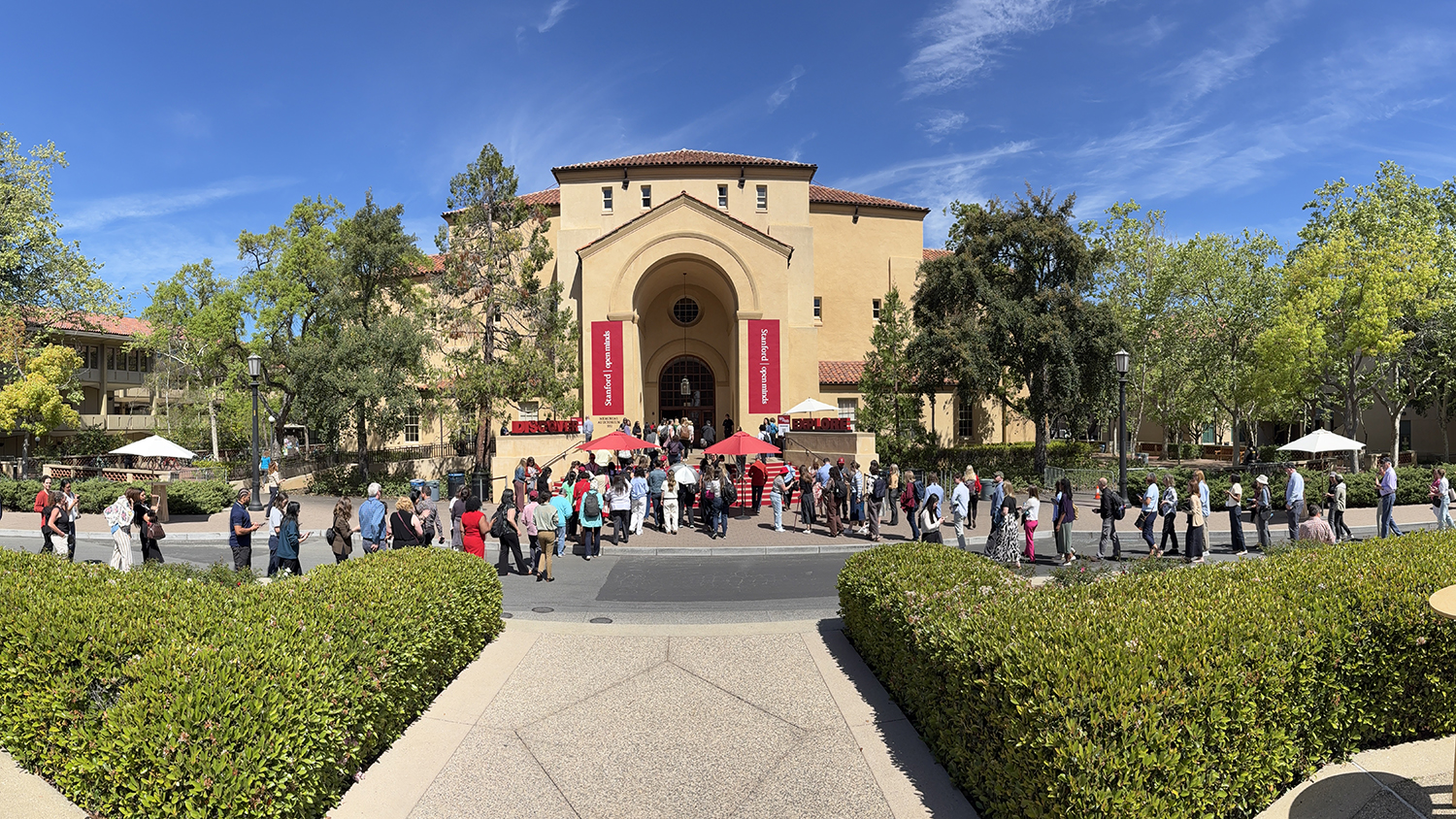 Staff lining up outside to attend the Open Minds welcome event.
