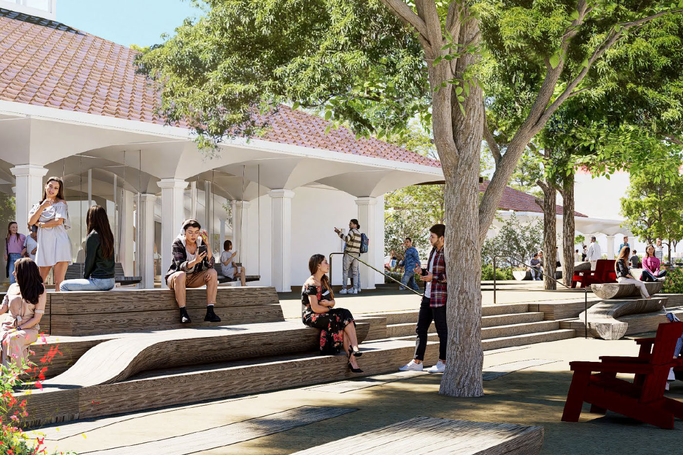 Students relax on tiered seating near a building with arched columns and mature trees.