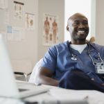 African American doctor in his office