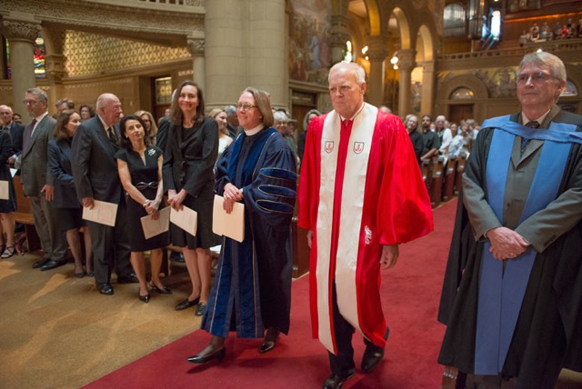 Jane Shaw and John Hennessy walking up the aisle of Memorial Church