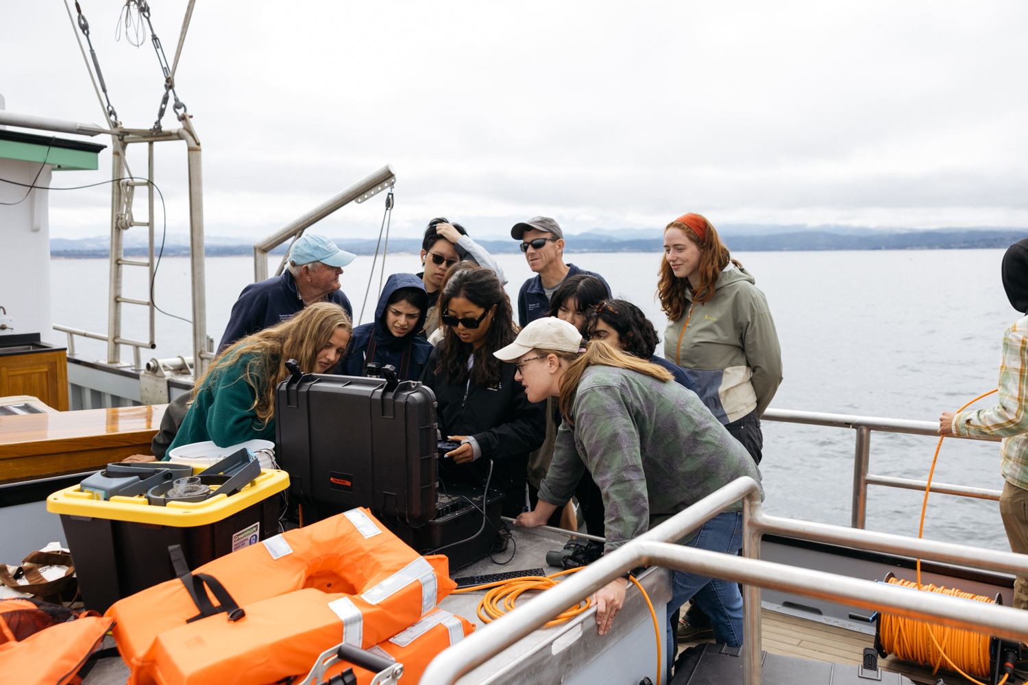 A group photo of the class on the deck of the Western Flyer.