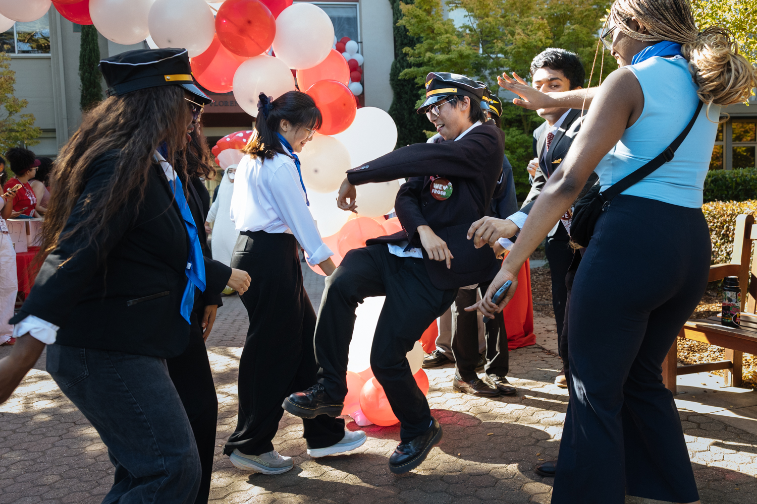 Orientation coordinators take part in a dance-off outside Florence Moore Hall.