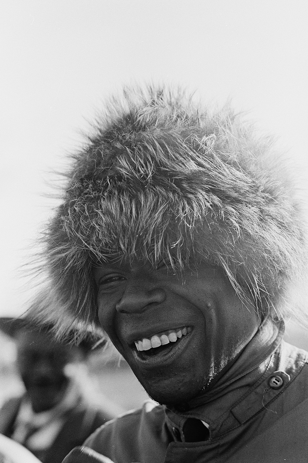 Closeup of an African American marcher in a furry hat.