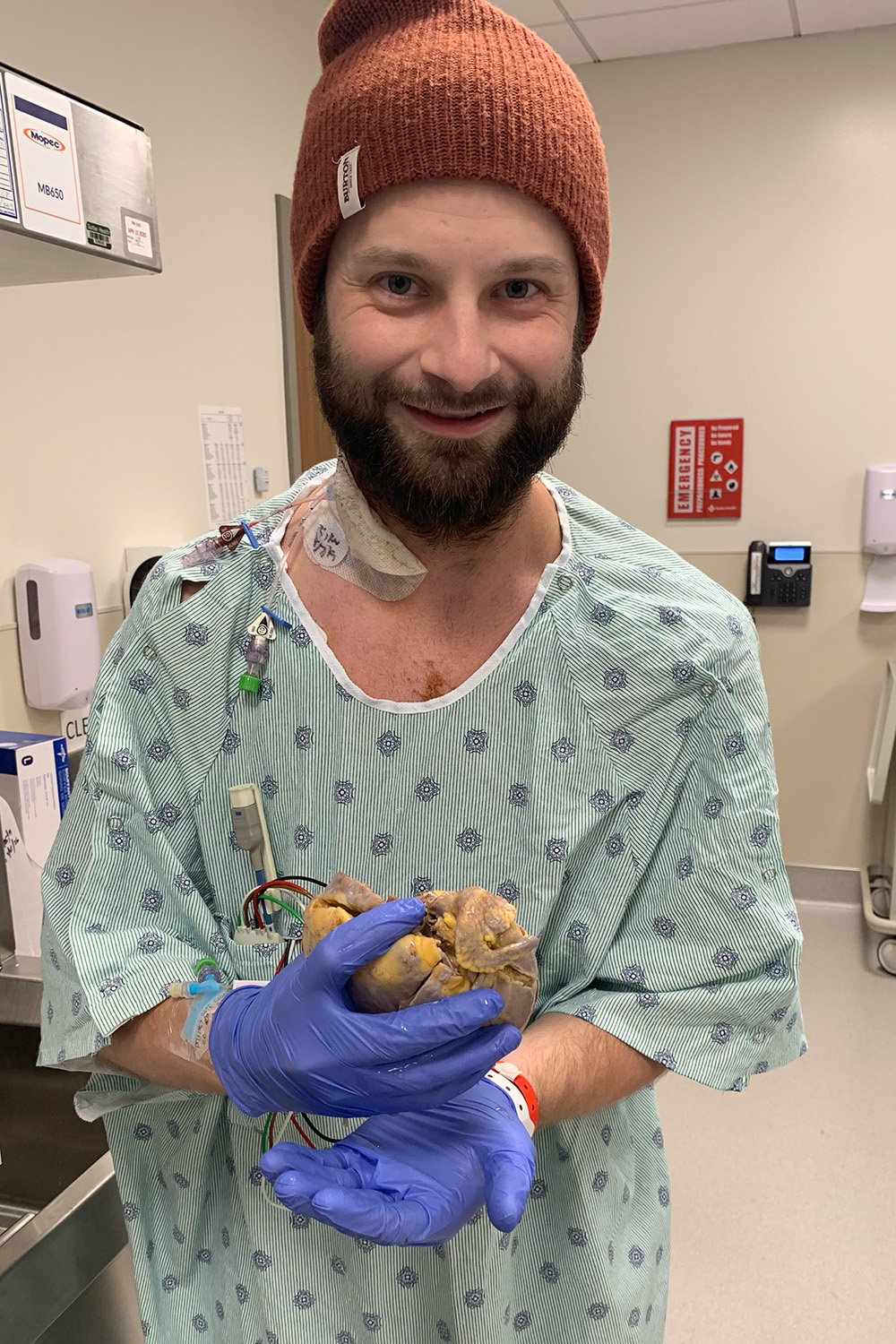 Mitch Peterson in a hospital room after surgery.