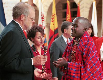 John Hennessy accepts congratulaitons from student Kimeli Willson Naiyomah in Maasai regalia