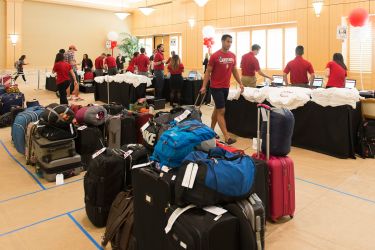 Admits check in at Arrillaga Alumni Center; their luggage is sorted into dorm destination groups.