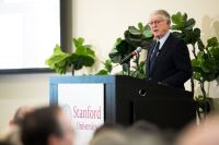 journalist Ted Koppel at the lectern speaking to a Stanford audience