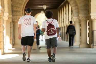 two students walking in arcade