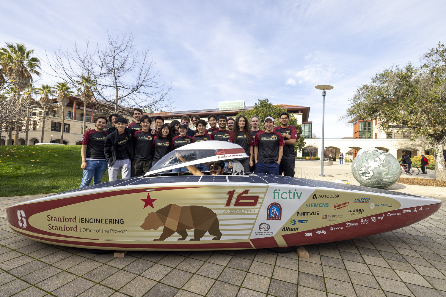 Students with solar car in the Engineering Quad (opens in a modal)