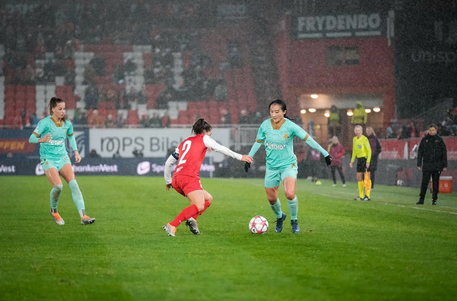 Michelle plays soccer on a rainy pitch in Prague.