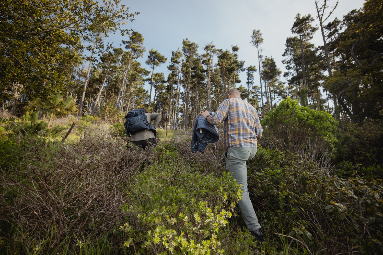 Image of Kabir Peay and graduate student Lauren Ward hiking to a field site in Point Reyes.