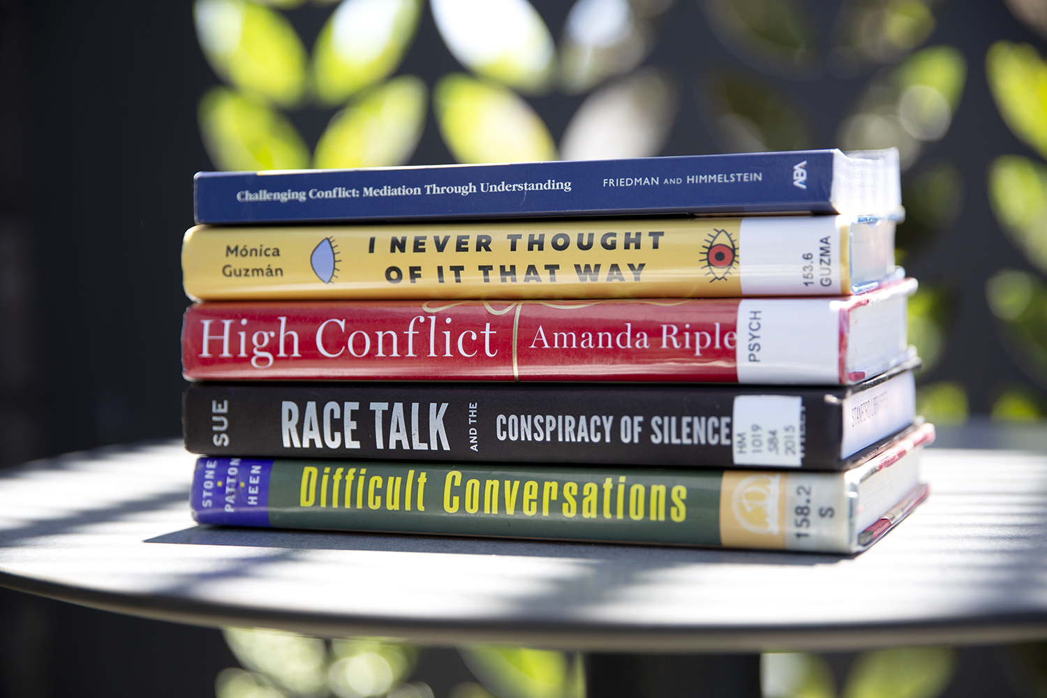 five books on a table