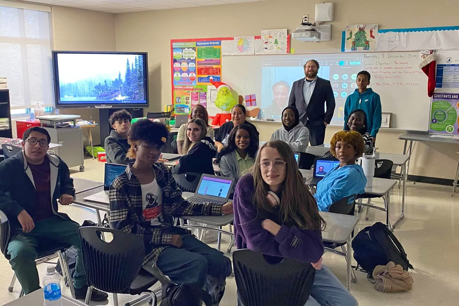 Antioch High School students in the Stanford course Introduction to Computers, in Nashville, Tennessee, turn in their desks to look at the camera for a photo.