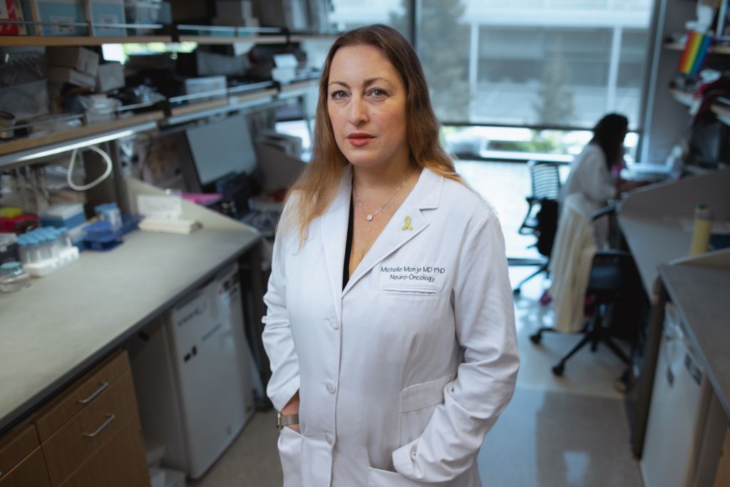 Profile photo of Michelle Monje posing for the photo in her lab.