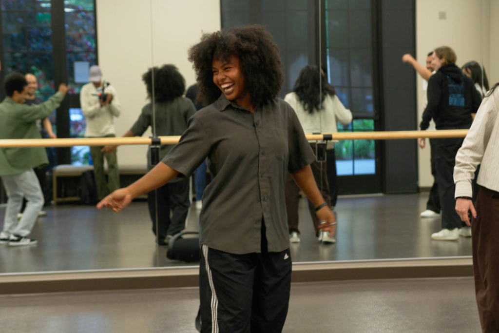 Open video Mia Clark laughing in the dance studio in a modal