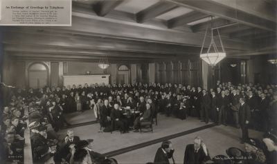 Ray Lyman Wilbur in Old Union amid a bank of phones