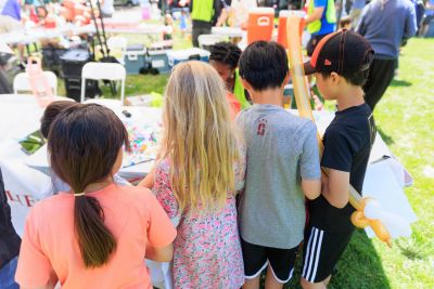 Children gathered at an arts and crafts table.