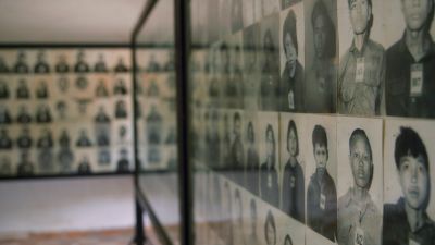 walls of photos of genocide victims
