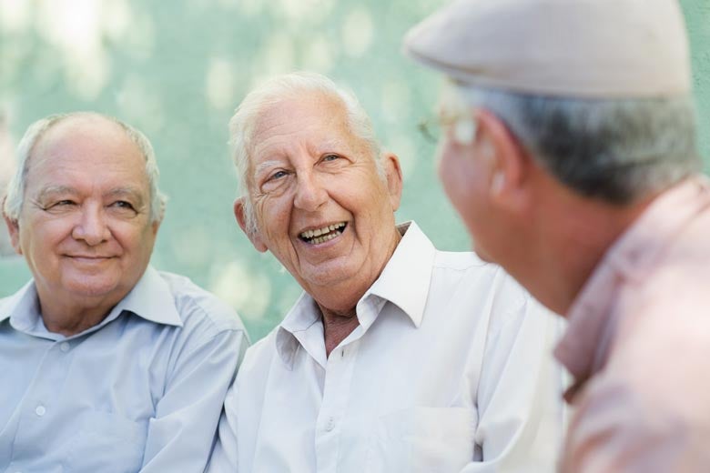 Three old men chatting happily