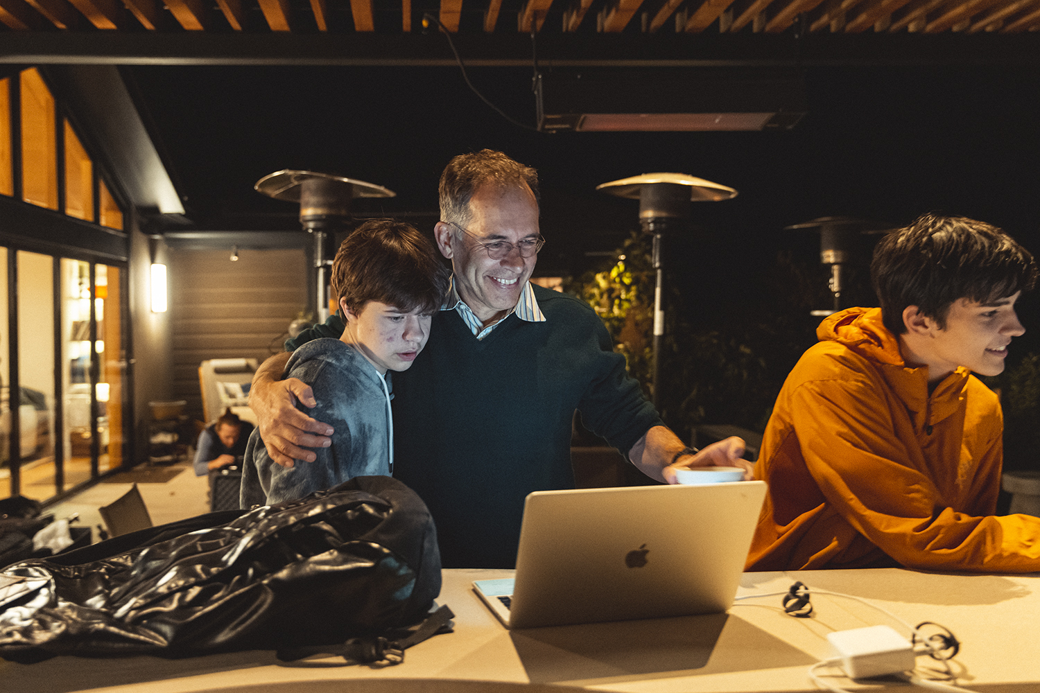 Guido Imbens and his sons, Andrew and Carleton, share a moment after the announcement that he won the Nobel Prize.