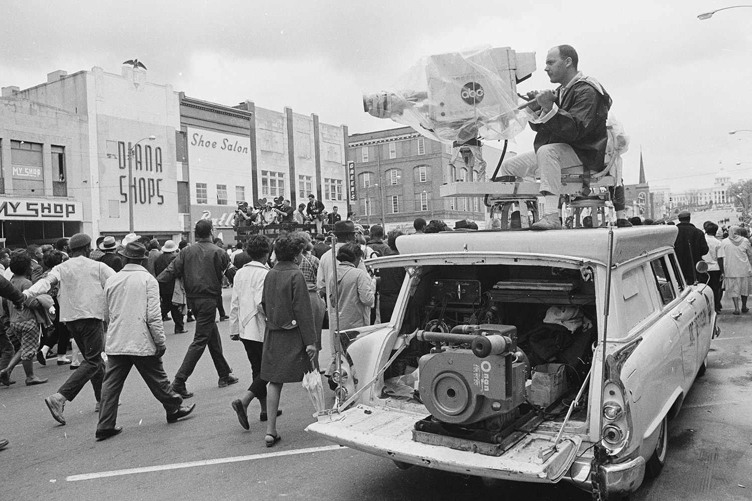 TV crew broadcasts the march.
