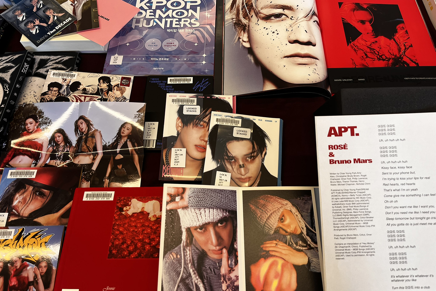 A collection of music albums and promotional material, featuring diverse artists, song lyrics, and themed artworks.