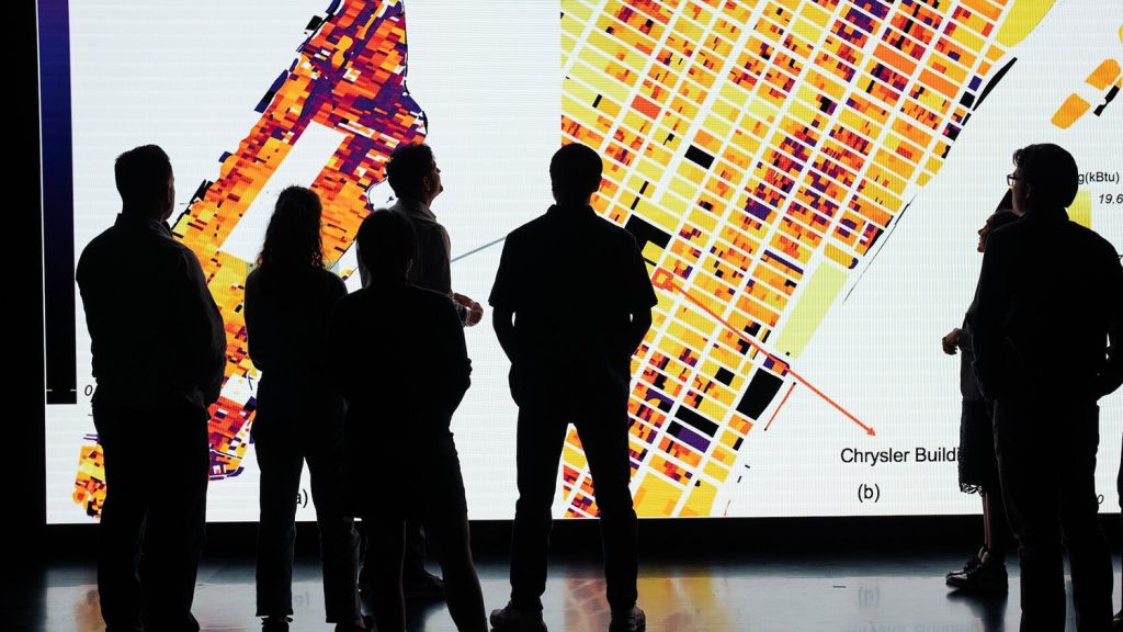 Open video Visitors view a large screen displaying an energy map of New York City. in a modal