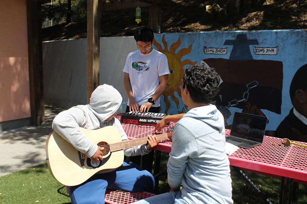 Canyon Oaks Youth Center teens make music outside the center