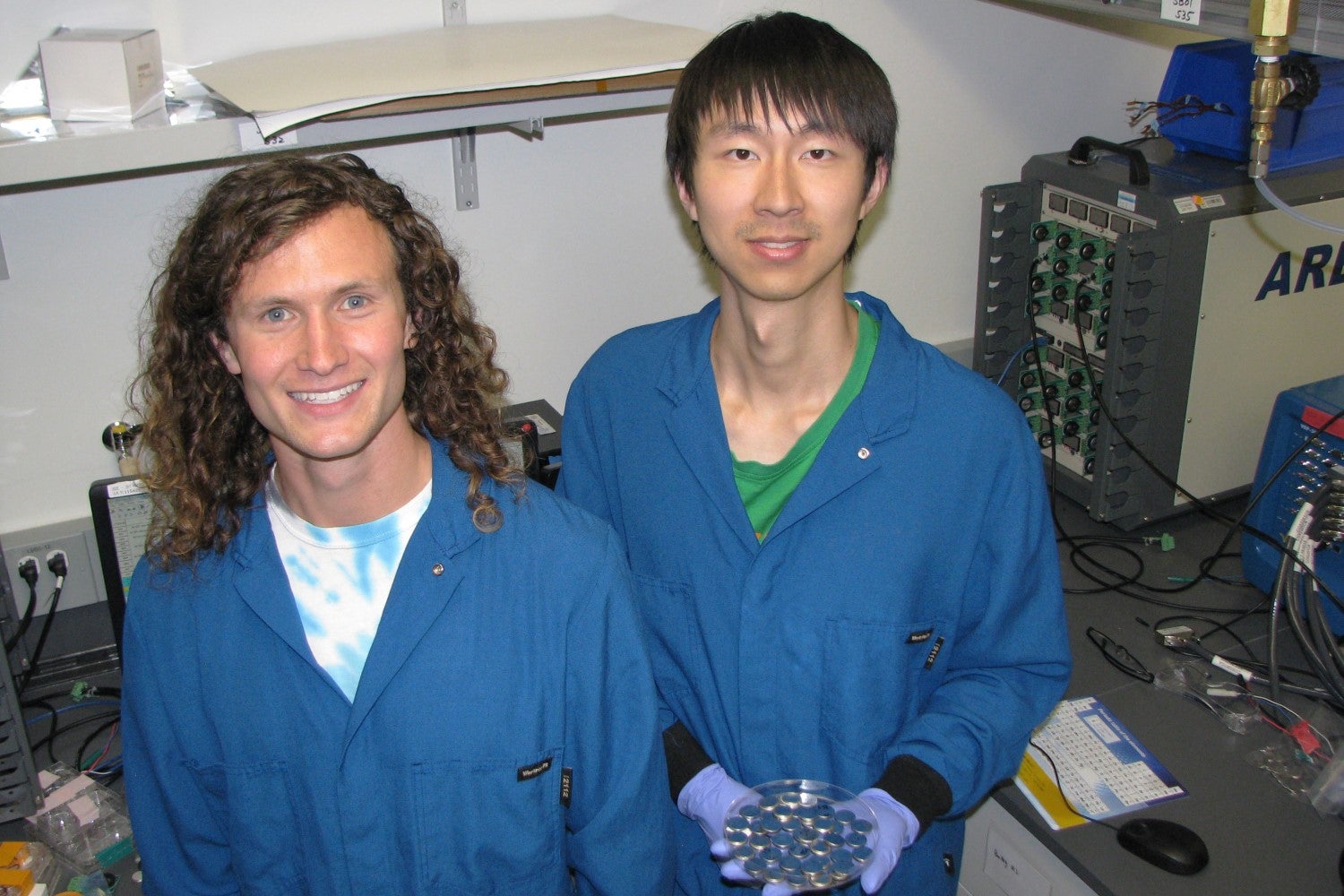PhD students David Mackanic, left, and Zhiao Yu in front of their battery tester.