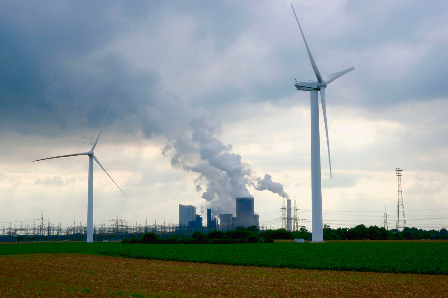 Wind turbines and Brown coal power plant in Bergheim, Rhine-Erft, Germany.