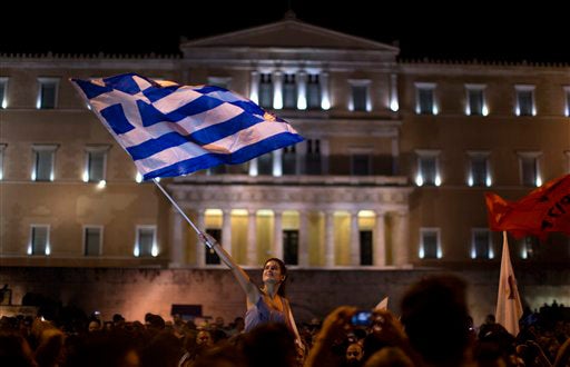 Greek demonstrators waving flag 