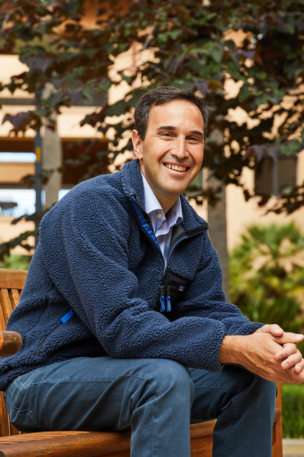 Jonathan Levin smiles in a blue fleece.