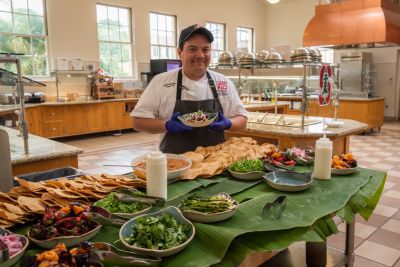 Chef Jason Sanchez posing with tostadas.