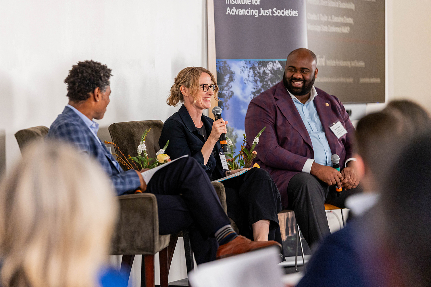 Professor Michelle Wilde Anderson on stage during a panel discussion moderated by Professor Brian Lowery.