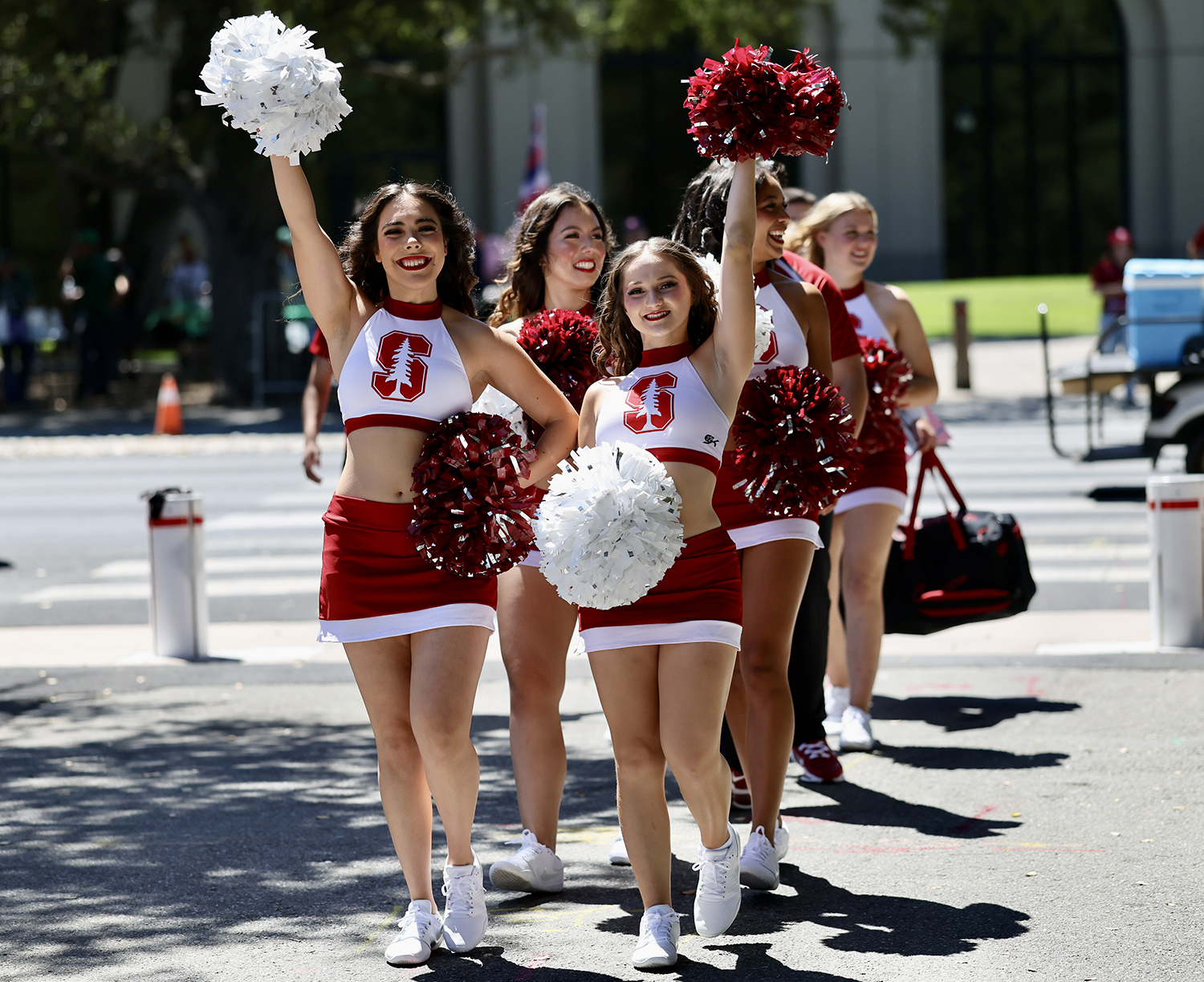 Stanford cheerleaders wave pom-poms before the game against Hawai’i.