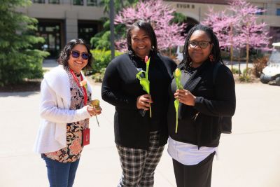 Three students in a group shot.