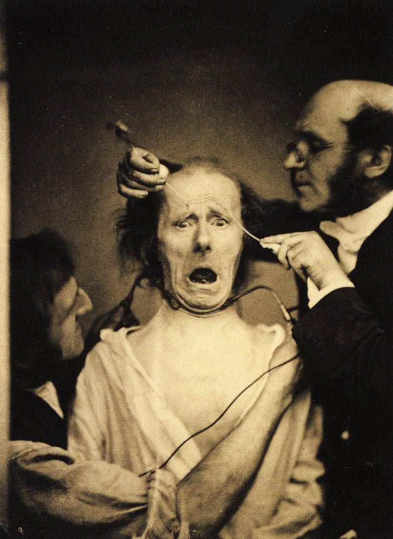 Man's face being manipulated into strange expression