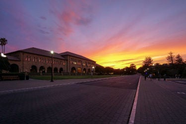 Sunset highlights the outside of the Main Quadrangle.