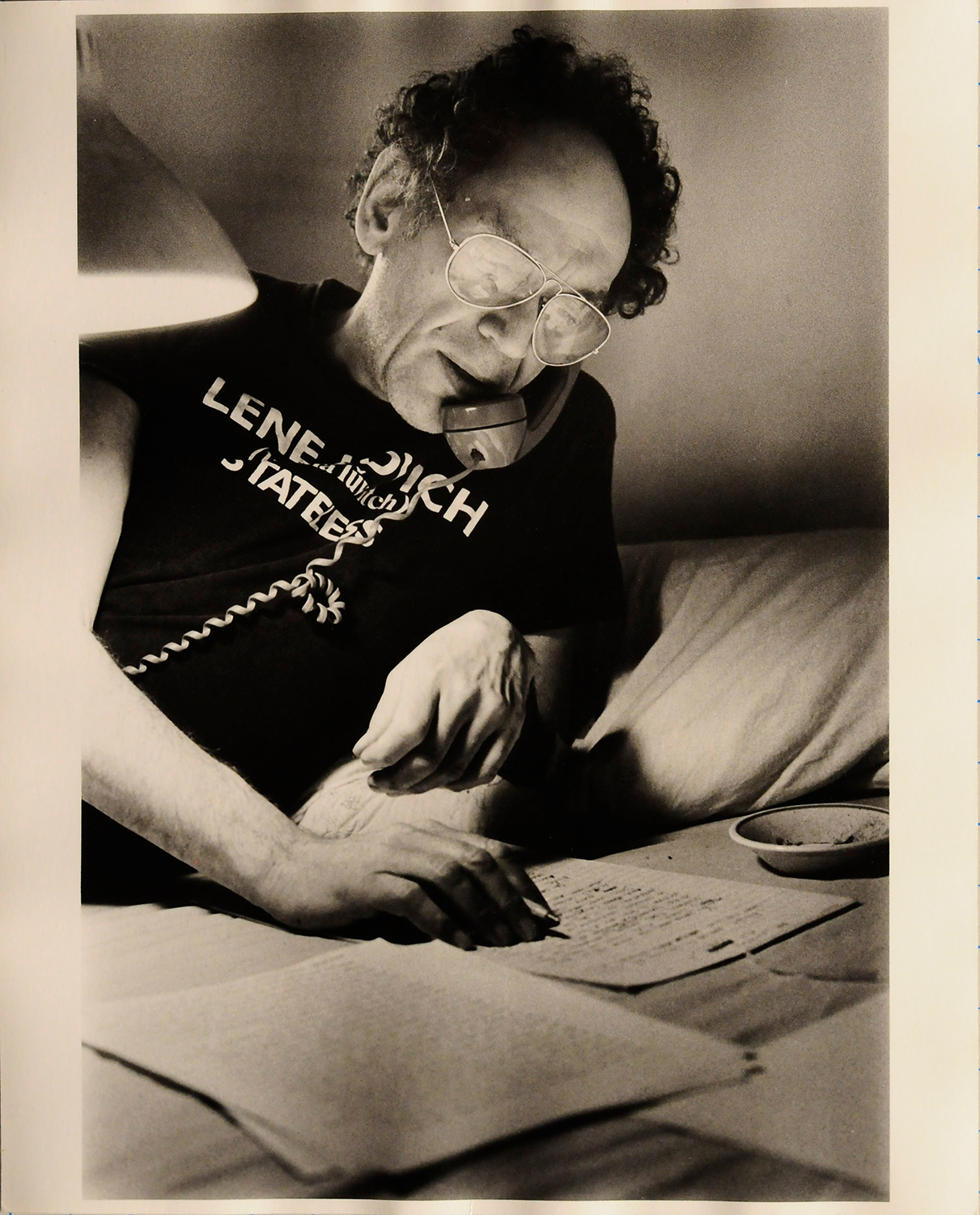 Image of Al Aronowitz in his home and talking to someone on the phone.