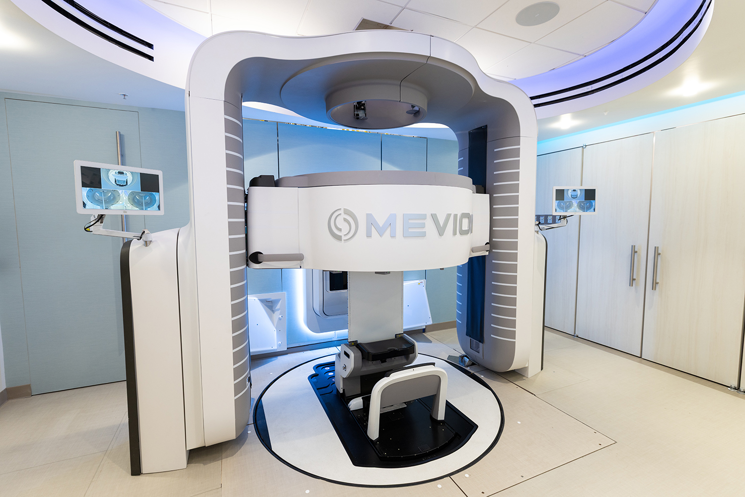 Open video A modern medical imaging machine, designed for advanced diagnostic scans, featuring a central scanning area and sleek, futuristic design. in a modal