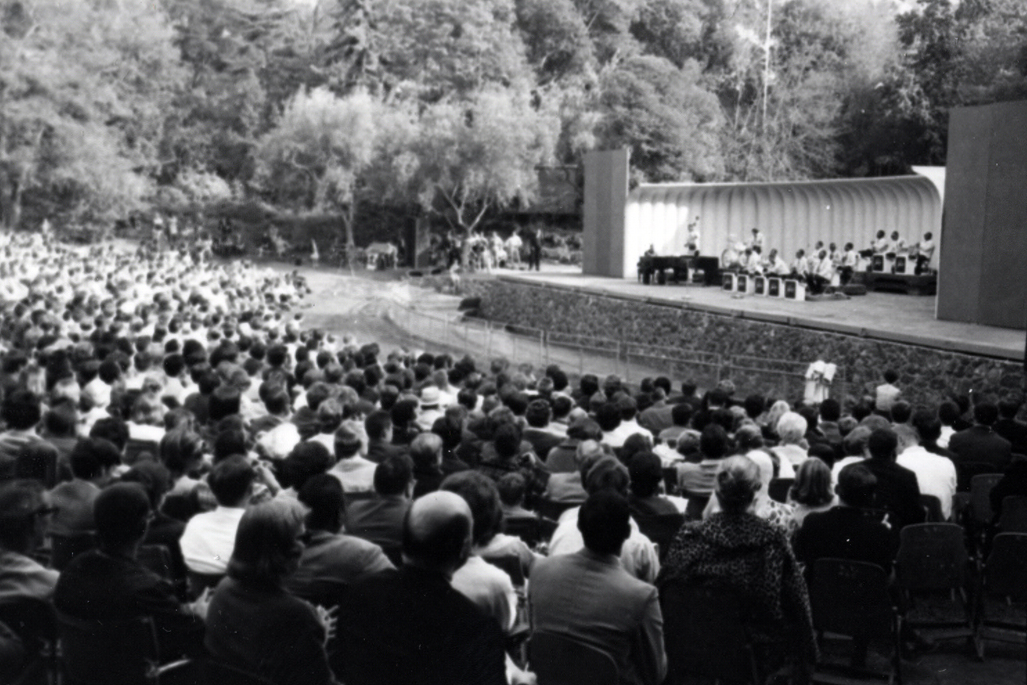 Duke Ellington and Ella Fitzgerald performing on stage at Frost with a view of the audience.