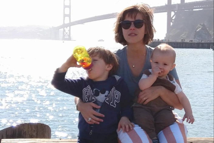 Zuckerman and kids pose by Golden Gate Bridge.