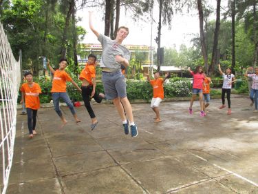 Sean Strong with children in Vietnam's Mekong Delta