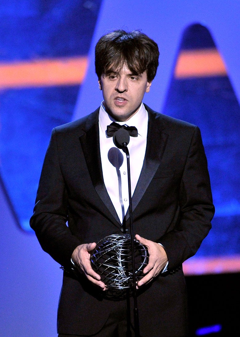 Karl Deisseroth at microphone with prize